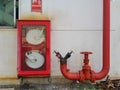 Fire hose reel sign and hose reel in box Royalty Free Stock Photo