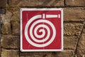 Fire hose wall sigh flat material design on the brick wall Royalty Free Stock Photo