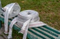 Fire hoses on a wooden bench in the afternoon Royalty Free Stock Photo