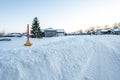 Fire hydrant with a locator protruding from a snow back along a residential street. Royalty Free Stock Photo