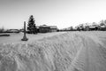 Fire hydrant with a locator protruding from a snow back along a residential street. Royalty Free Stock Photo