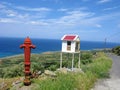 Fire hydrant near road to the sea Royalty Free Stock Photo