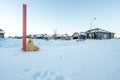 Fire hydrant with a locator protruding from a snow back along a residential street. Royalty Free Stock Photo