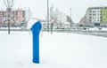 Blue fire hydrant for firefighters on the street in the city with snow in the winter season Royalty Free Stock Photo