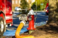 Fire hydrant water supply during emergency hooked to hose Royalty Free Stock Photo