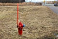 a fire hydrant in winter with long red stem snow marker for cold climates midwest usa Royalty Free Stock Photo