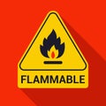 Fire icon and inscription flammable. yellow warning triangle on the wall. Royalty Free Stock Photo