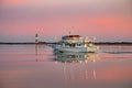 Fire Island, New York - December 11, 2019 : Captree Princess fishing boat sailing through the Great South Bay at sunset Royalty Free Stock Photo