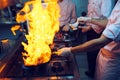 Fire in the kitchen. Fire gas burn is cooking on iron pan,stir fire very hot Royalty Free Stock Photo