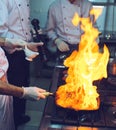 Fire in the kitchen. Fire gas burn is cooking on iron pan,stir fire very hot. Royalty Free Stock Photo