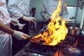 Fire in the kitchen. Fire gas burn is cooking on iron pan,stir fire very hot. Royalty Free Stock Photo