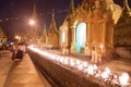 Fire lit up for prayer at Crowded & Shwedagon Pagoda in the evening during sunset