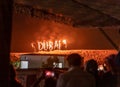 The fire lords behind outer walls show traditional Arabic performance in Adventure Planet Tourism - Dubai Desert Safari at sandy