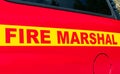 Fire Marshal text on the side of the red car Royalty Free Stock Photo