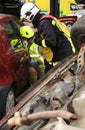 Fire officers at car crash Royalty Free Stock Photo