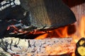 Fire and oven. Wood dark hard logs burning, orange flames and hot temperature Royalty Free Stock Photo