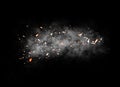 Fire particle . Embers debris on black background. Smoke on background texture.
