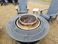 Fire pit with chairs in park Royalty Free Stock Photo
