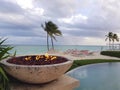 Fire pit next to a infinity pool in the beach in the island of Nassau, Bahamas