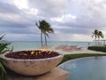 Fire pit next to a infinity pool in the beach in the island of Nassau, Bahamas