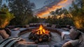 The fire pit is surrounded by plush cushions and throw blankets making it the ultimate spot for relaxation and warmth on Royalty Free Stock Photo