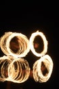 Fire Poi Performance on Beach at Night. Royalty Free Stock Photo