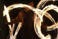 Fire Poi Performance on Beach at Night. Royalty Free Stock Photo