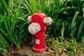A fire red hydrant in the grass Royalty Free Stock Photo