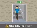 Fire safety activity. Young man going down stairs to escape a fire. Royalty Free Stock Photo