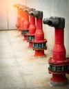 Fire safety pump on cement floor of concrete building. Deluge system of firefighting system. Plumbing fire protection. Red fire Royalty Free Stock Photo