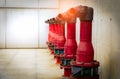 Fire safety pump on cement floor of concrete building. Deluge system of firefighting system. Plumbing fire protection. Red fire Royalty Free Stock Photo