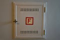 Fire safety sign, red F in a German house Royalty Free Stock Photo