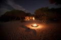 Summerhouse on the island with the bonfire. Night at the coast.