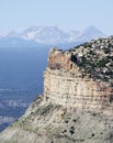 A Fire Scorched Mesa Verde with Alpine Peaks Behind