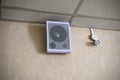 A fire sensor on the ceiling and a sound speaker