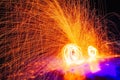 Fire show. Amazing fire performance in the night. Abstract fife sparks background. Long-exposure photography captures Royalty Free Stock Photo