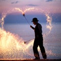 Fire show on the beach at sunset Royalty Free Stock Photo