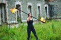 Fire show girl with flaming torches Royalty Free Stock Photo