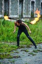 Fire show girl with flaming torches Royalty Free Stock Photo