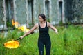 Fire show girl with flaming torches Royalty Free Stock Photo