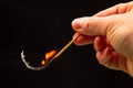 Fire and smoke. Burning match in hand on a black background. Heat and light from fire flame Royalty Free Stock Photo