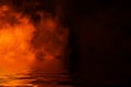 Fire smoke with reflection in water. Mistery fog texture background Royalty Free Stock Photo