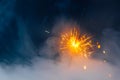 Fire sparkler in dense smoke, abstract Christmas firework background Royalty Free Stock Photo