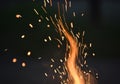 Fire sparks and flame trail isolated on dark background with dynamic motion effect Royalty Free Stock Photo