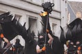 Fire spitting dragon marching through the street