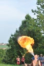 Fire spitting juggler