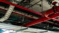 Fire sprinkler system with red pipes hanging from ceiling inside building. Fire Suppression. Fire protection and detector. Main Royalty Free Stock Photo