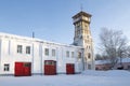 Fire station building and an old fire tower on a sunny January day. Tutaev