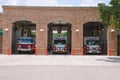 Fire station firehouse with paramedics & fire trucks Royalty Free Stock Photo