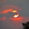 Fire sun behind storm clouds Royalty Free Stock Photo